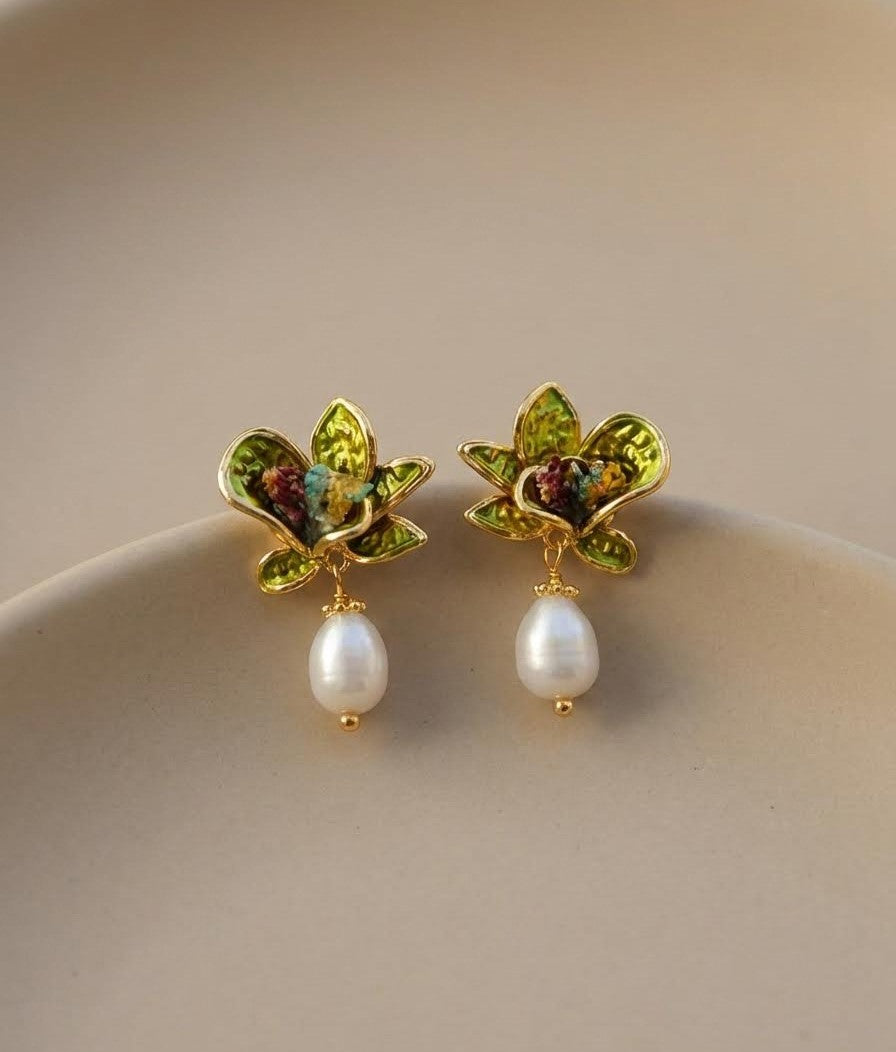 Monet-inspired earrings featuring green floral elements and pearl drops, perfect for social occasions or evening wears