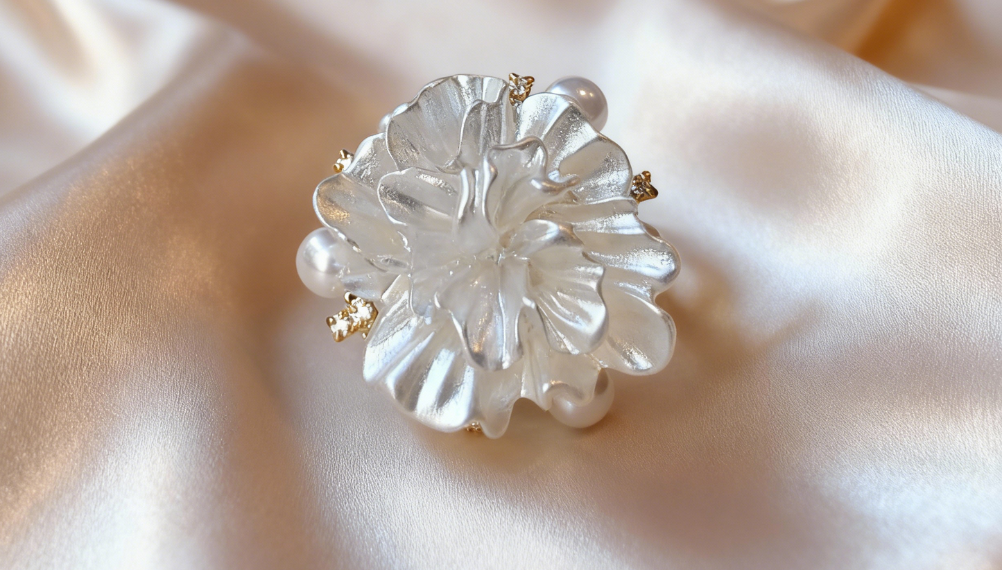 Luxury minimalist pearl ring inspired by sunrise melting over fresh snow, nature-inspired jewelry