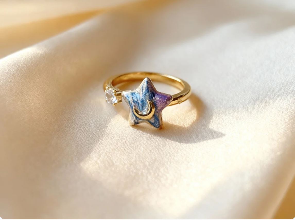 Ring with spinning star charm that brings joy and inspiration