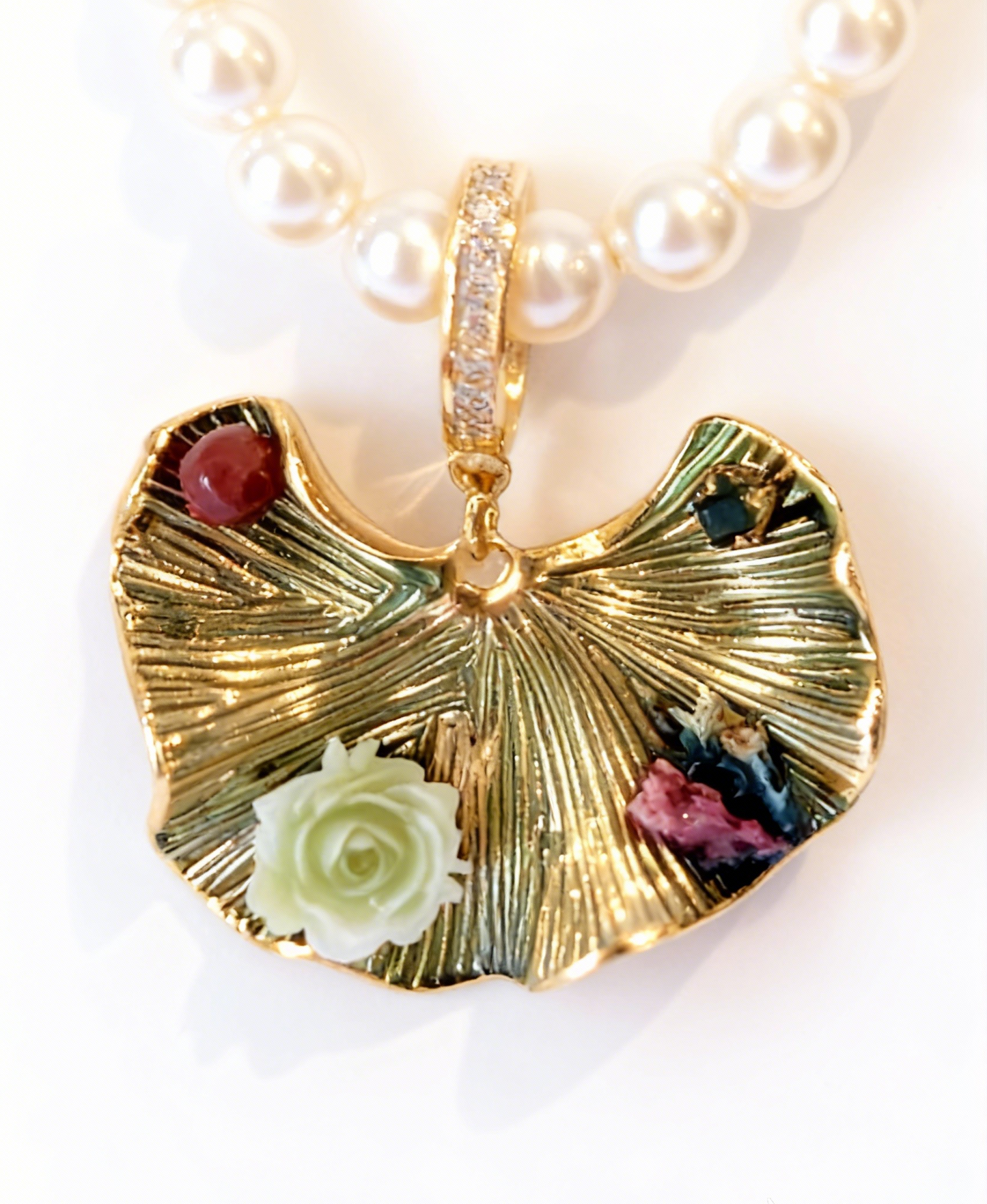 Gold leaf-shaped pendant with gemstones on a pearl necklace, mom gift